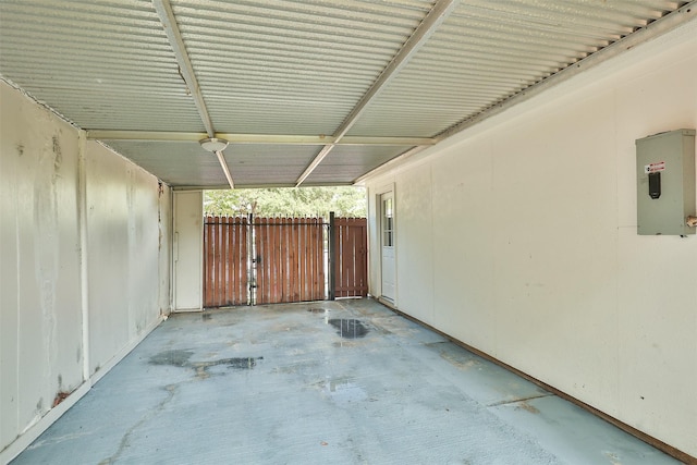 view of patio / terrace featuring electric panel and fence