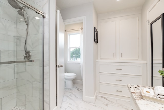 bathroom with walk in shower and toilet