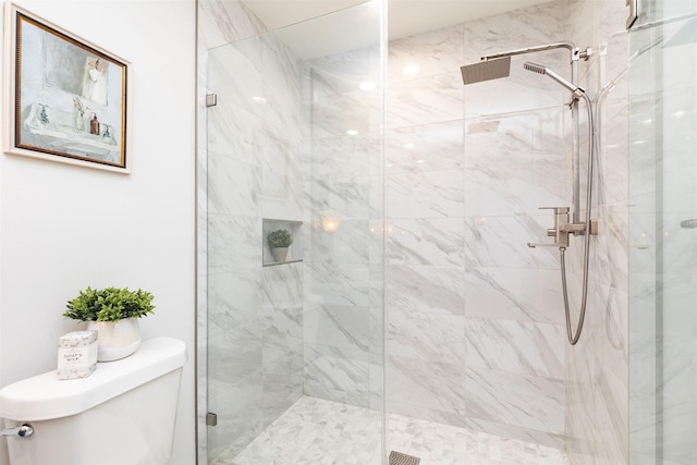 full bathroom featuring a marble finish shower and toilet