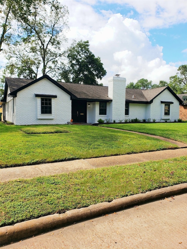 ranch-style home with a front yard