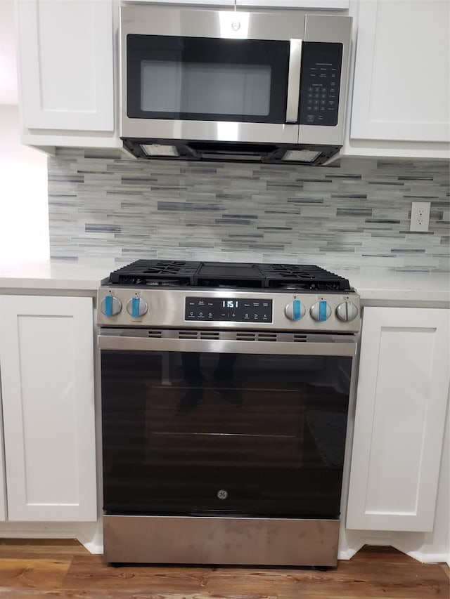 kitchen featuring appliances with stainless steel finishes and white cabinets