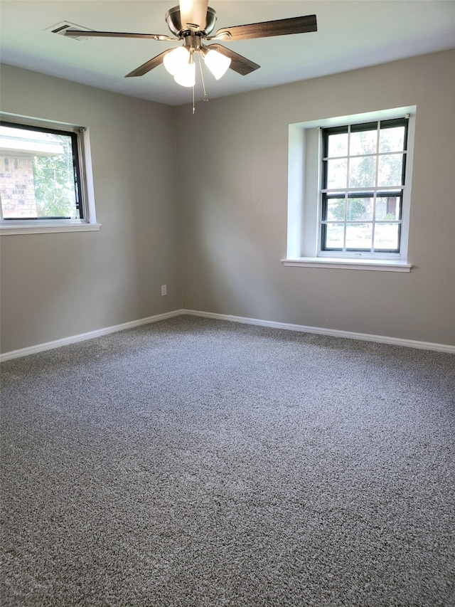 carpeted empty room with ceiling fan