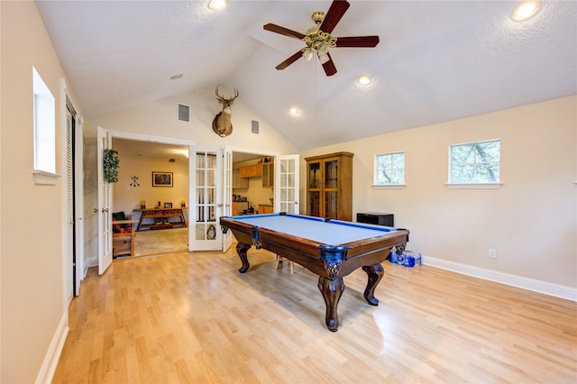 recreation room featuring a textured ceiling, light wood-type flooring, ceiling fan, french doors, and pool table