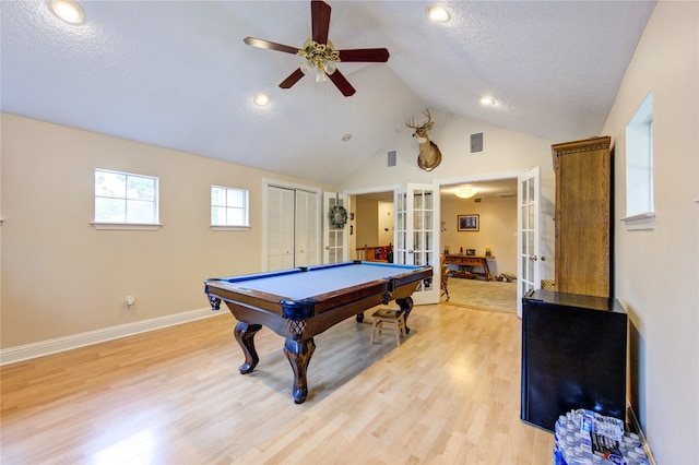 game room with ceiling fan, french doors, a textured ceiling, pool table, and light wood-type flooring