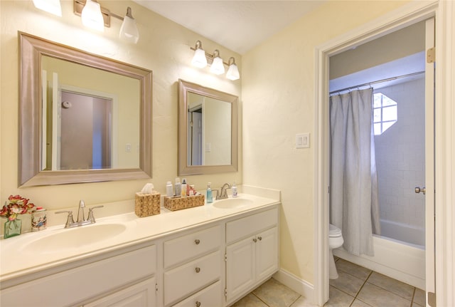 full bathroom with vanity, tile patterned floors, toilet, and shower / tub combo with curtain