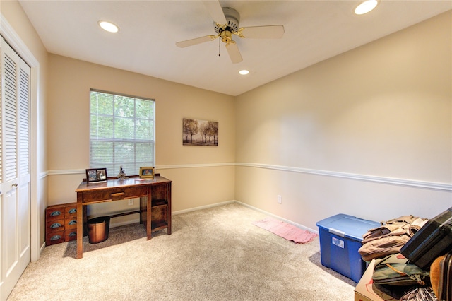 office space with ceiling fan and light colored carpet