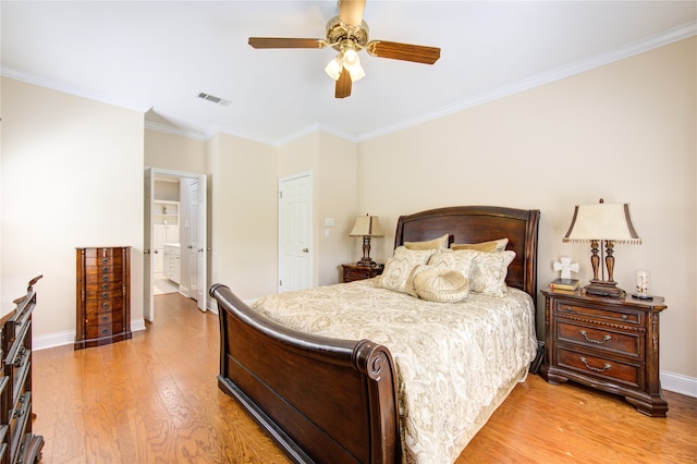 bedroom with ornamental molding, light hardwood / wood-style floors, and ceiling fan