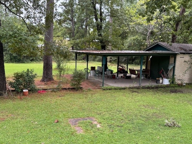 exterior space featuring a patio and a yard