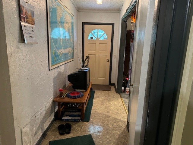 entryway featuring a textured ceiling