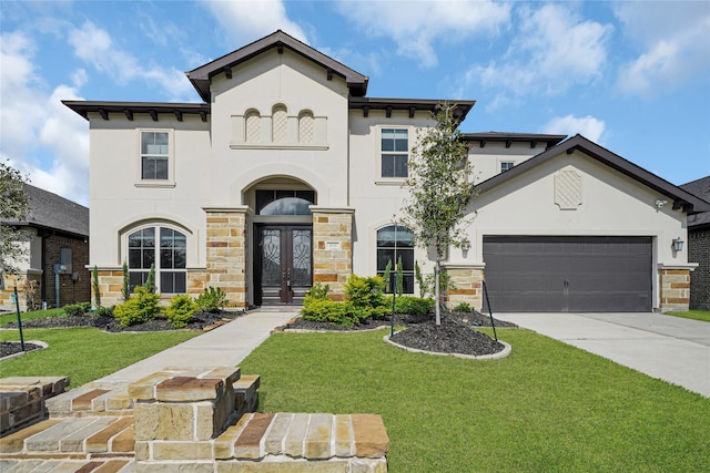 view of front of home with a garage and a front yard