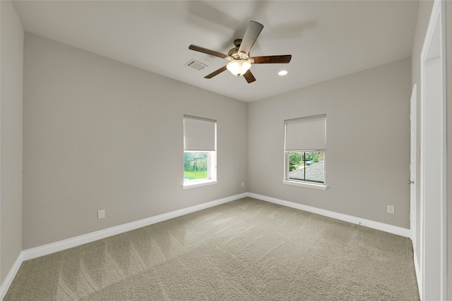 carpeted empty room featuring ceiling fan