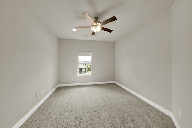 unfurnished room with ceiling fan and carpet floors