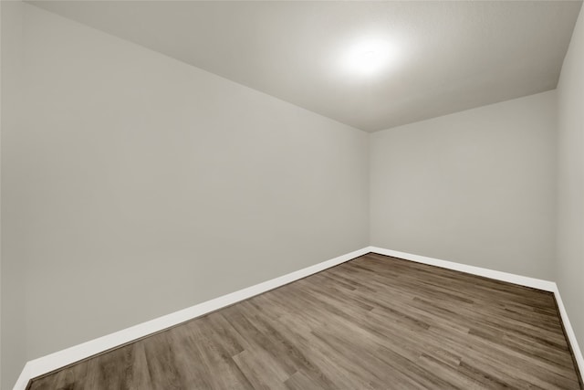 spare room featuring hardwood / wood-style flooring