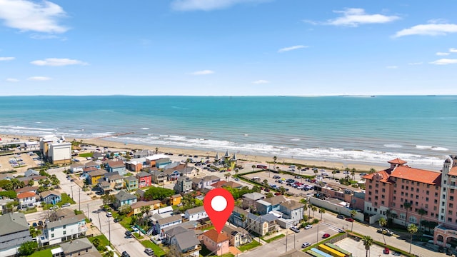 bird's eye view with a water view and a view of the beach