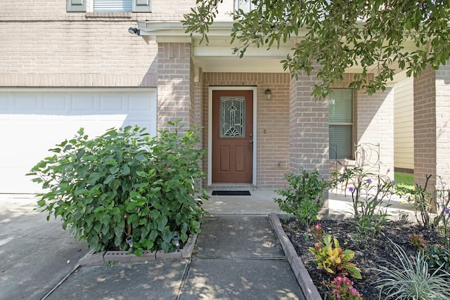 property entrance with a garage