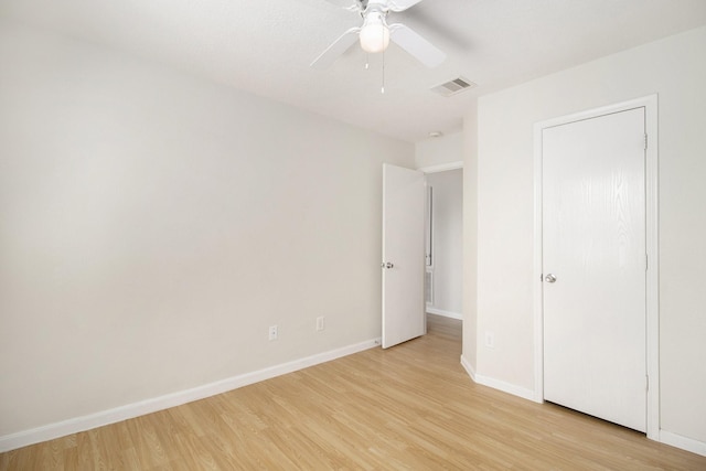 unfurnished bedroom with ceiling fan and light hardwood / wood-style floors