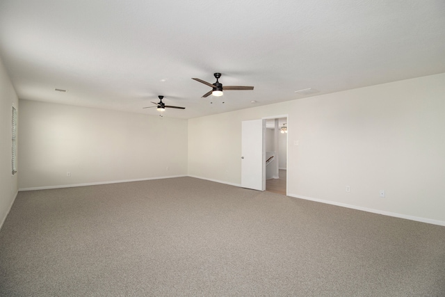 carpeted empty room featuring ceiling fan