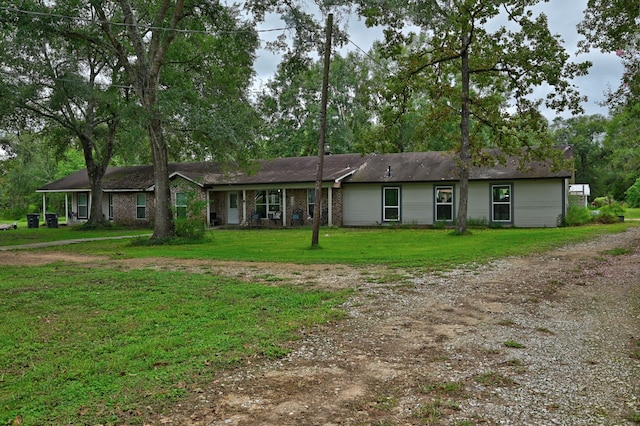 ranch-style home with a front yard