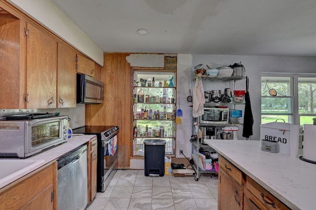 kitchen with appliances with stainless steel finishes and sink