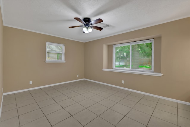 empty room with ornamental molding, a textured ceiling, light tile patterned floors, and ceiling fan