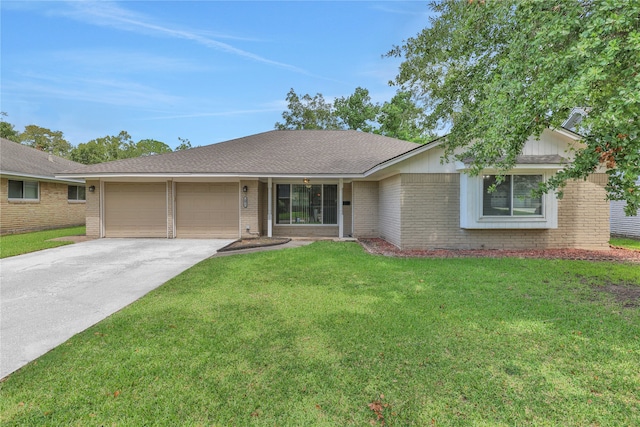 ranch-style home featuring a garage and a front yard