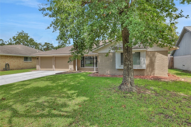 ranch-style house featuring a garage and a front lawn