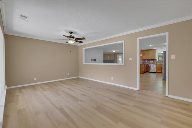 empty room with ceiling fan, ornamental molding, a textured ceiling, and light hardwood / wood-style flooring