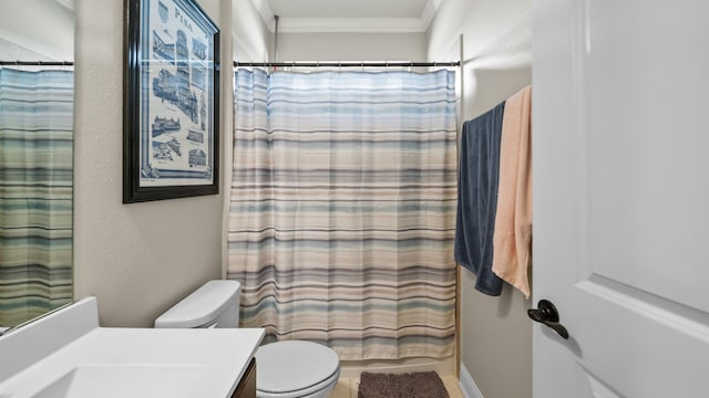 bathroom with crown molding, vanity, toilet, and a shower with curtain