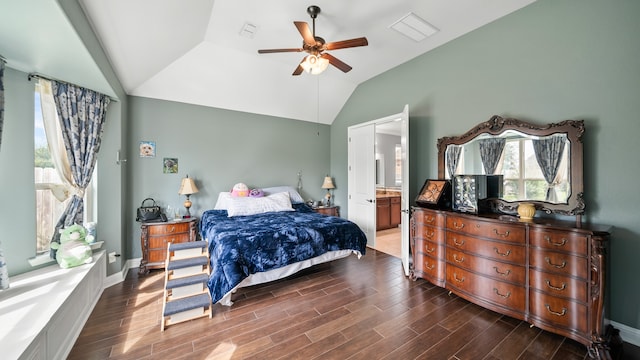 bedroom featuring ensuite bath, lofted ceiling, ceiling fan, and dark hardwood / wood-style floors