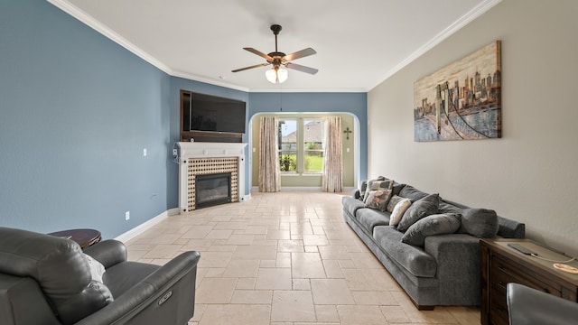 living room with ceiling fan and ornamental molding