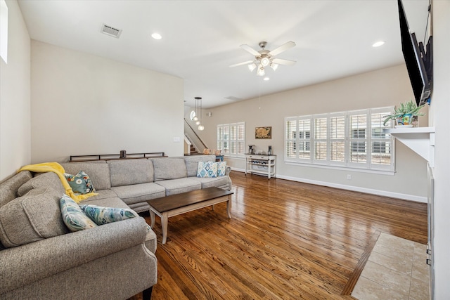 living room featuring ceiling fan, a healthy amount of sunlight, and hardwood / wood-style floors