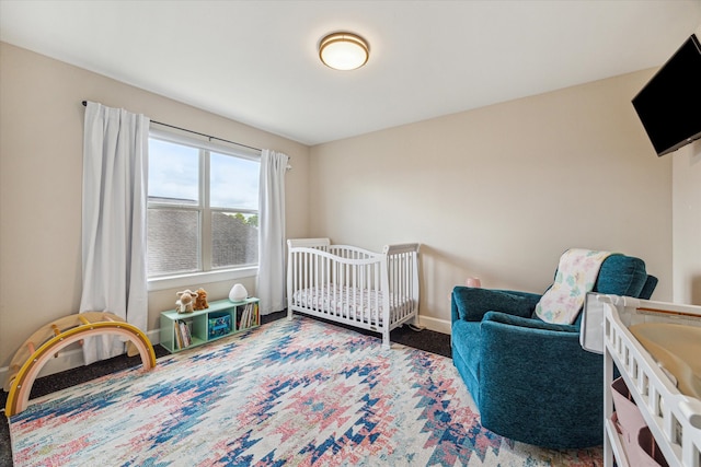 bedroom with a nursery area