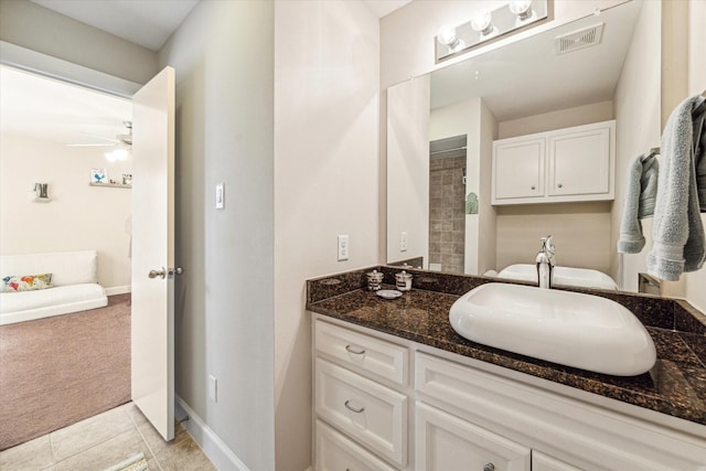 bathroom featuring ceiling fan, tile patterned floors, and vanity