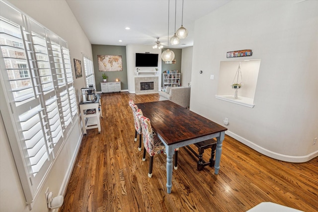 dining space featuring hardwood / wood-style floors and ceiling fan