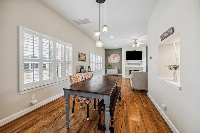 dining space with ceiling fan and hardwood / wood-style floors