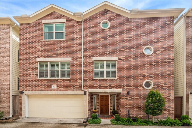 townhome / multi-family property featuring a garage