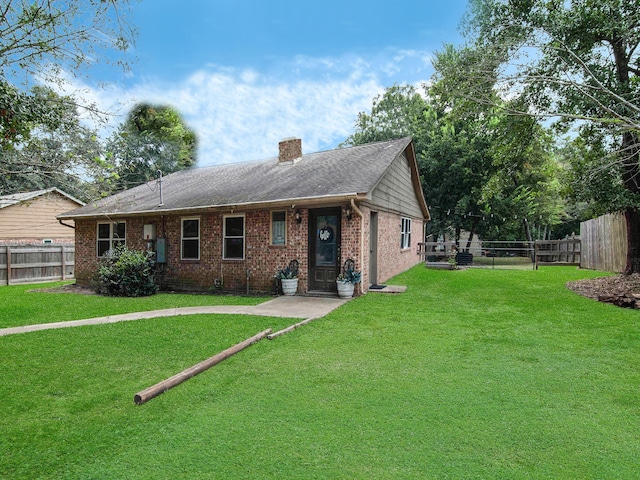 single story home featuring a front yard