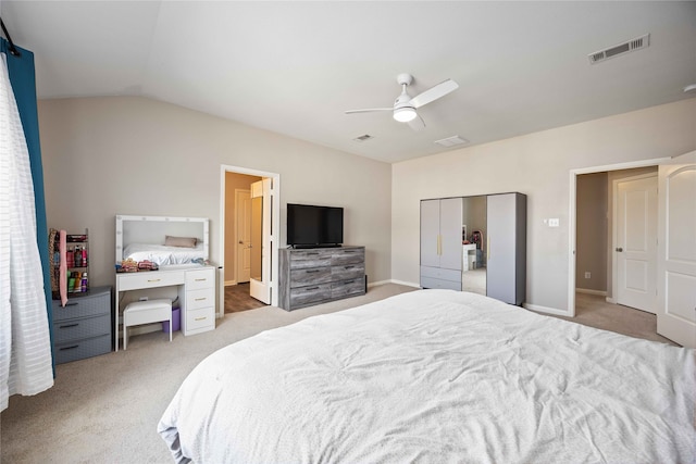 bedroom featuring ceiling fan, light colored carpet, and lofted ceiling