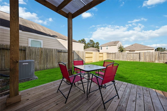 wooden deck with central AC unit and a yard