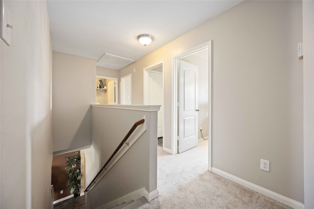 hallway with light colored carpet