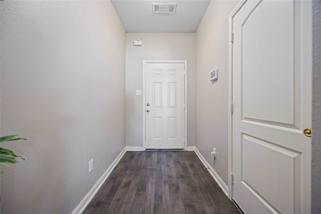 entryway with dark hardwood / wood-style floors