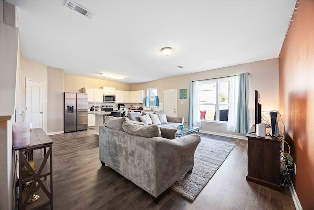 living room featuring dark wood-type flooring