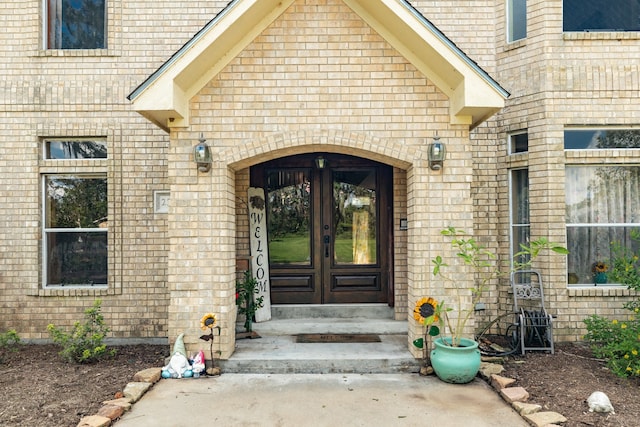 property entrance featuring french doors