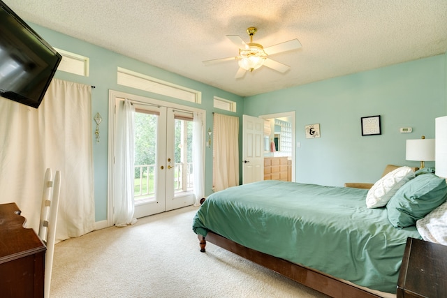 bedroom with light colored carpet, access to exterior, ceiling fan, and a textured ceiling