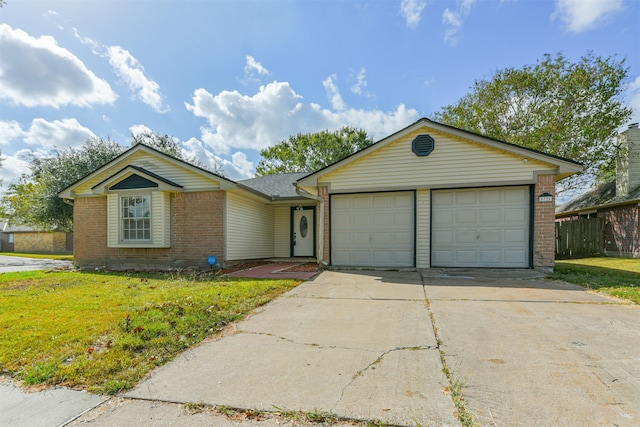 single story home featuring a garage and a front lawn