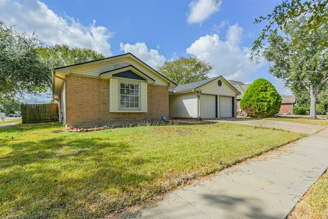 view of front facade featuring a front yard and a garage