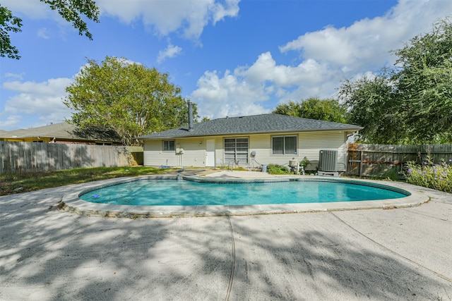 view of swimming pool featuring a patio and cooling unit