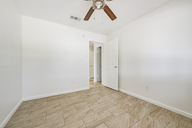 unfurnished room with ceiling fan