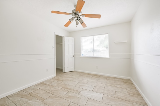 unfurnished bedroom featuring a closet and ceiling fan