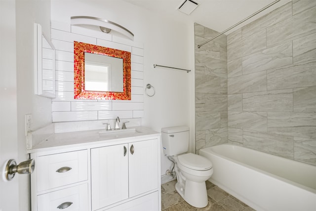 full bathroom with vanity, toilet, and tiled shower / bath combo